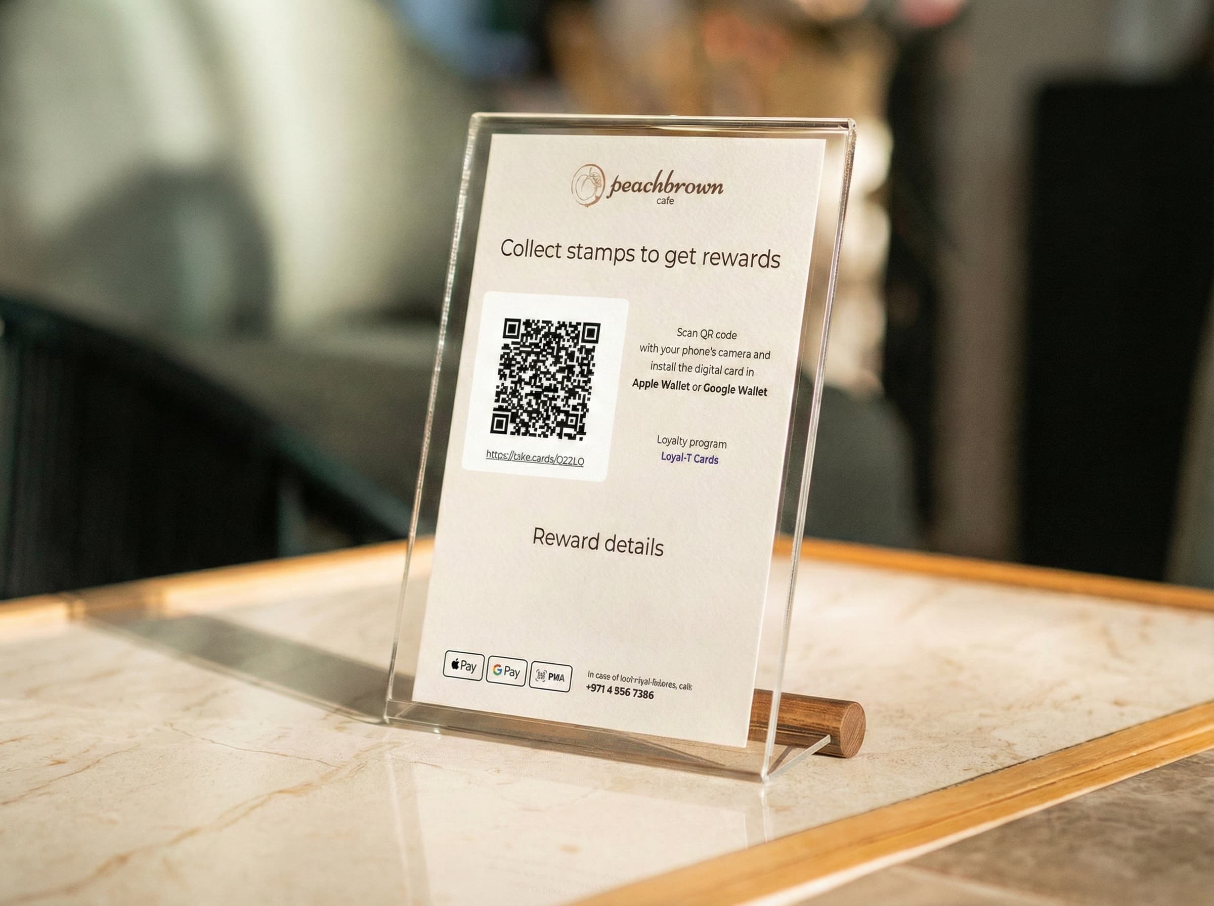 Peachbrown Cafe QR stand on a counter inviting customers to collect stamps and add the loyalty card to Apple Wallet or Google Wallet